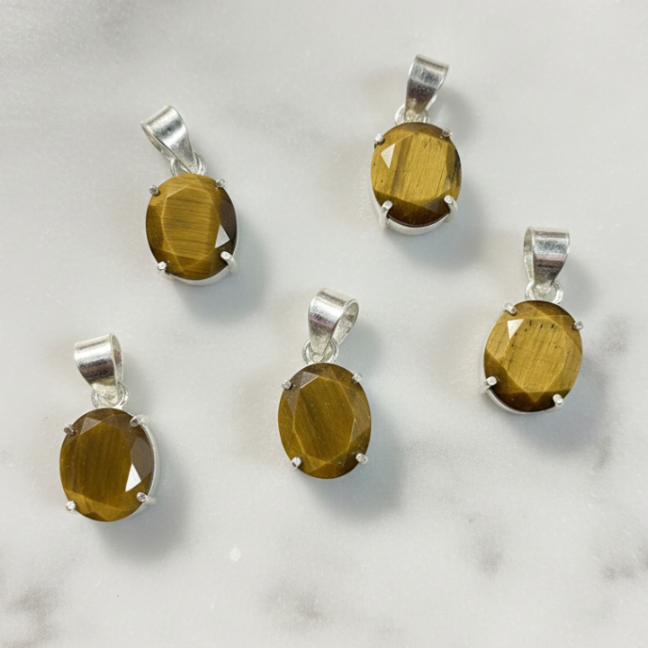 Close-up of Tiger Eye Pendant showing golden-brown crystal patterns for grounding and positive energy.